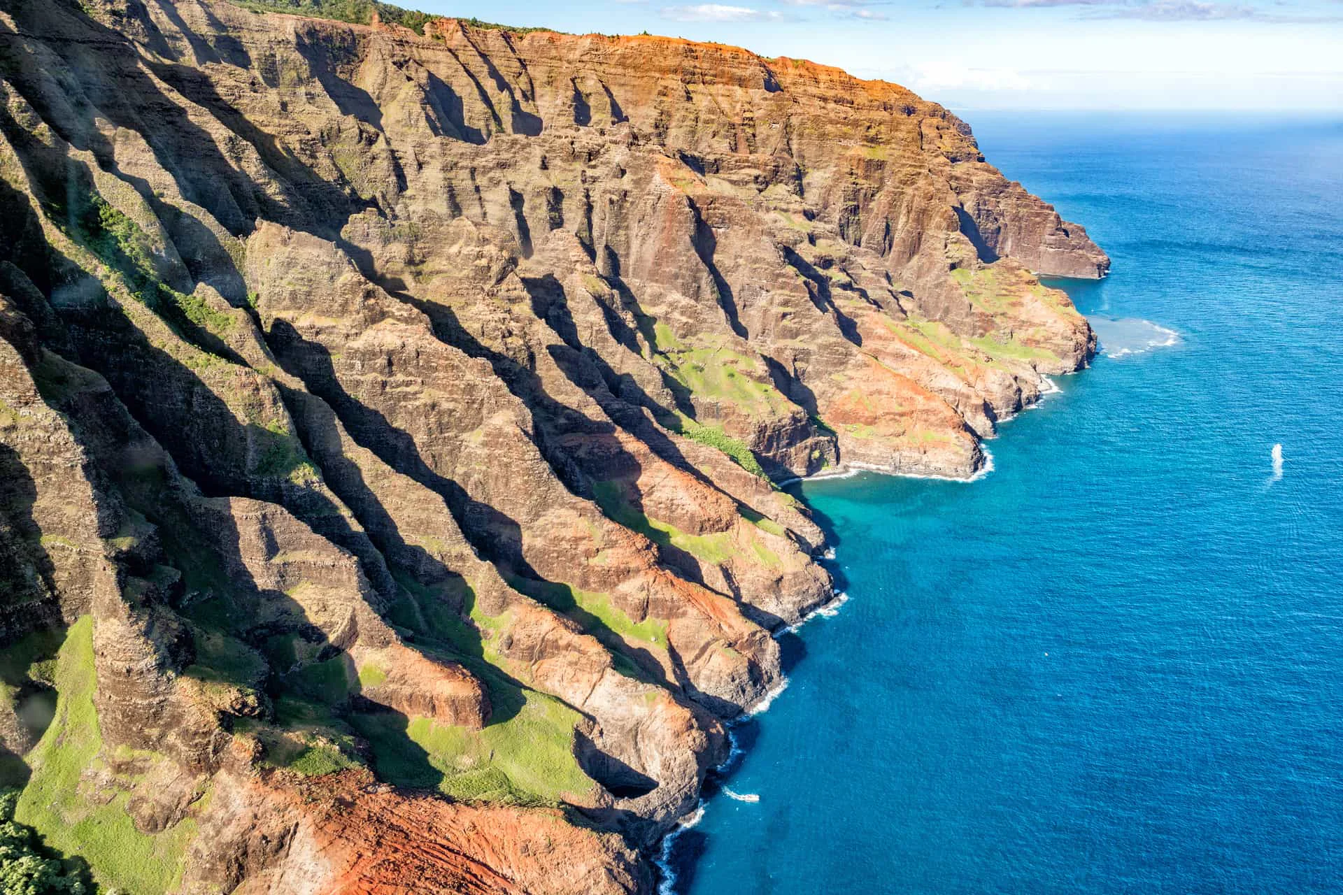 Aerial view of the Na Pali Coast cliffs on Kauai, Hawaii from a helicopter
