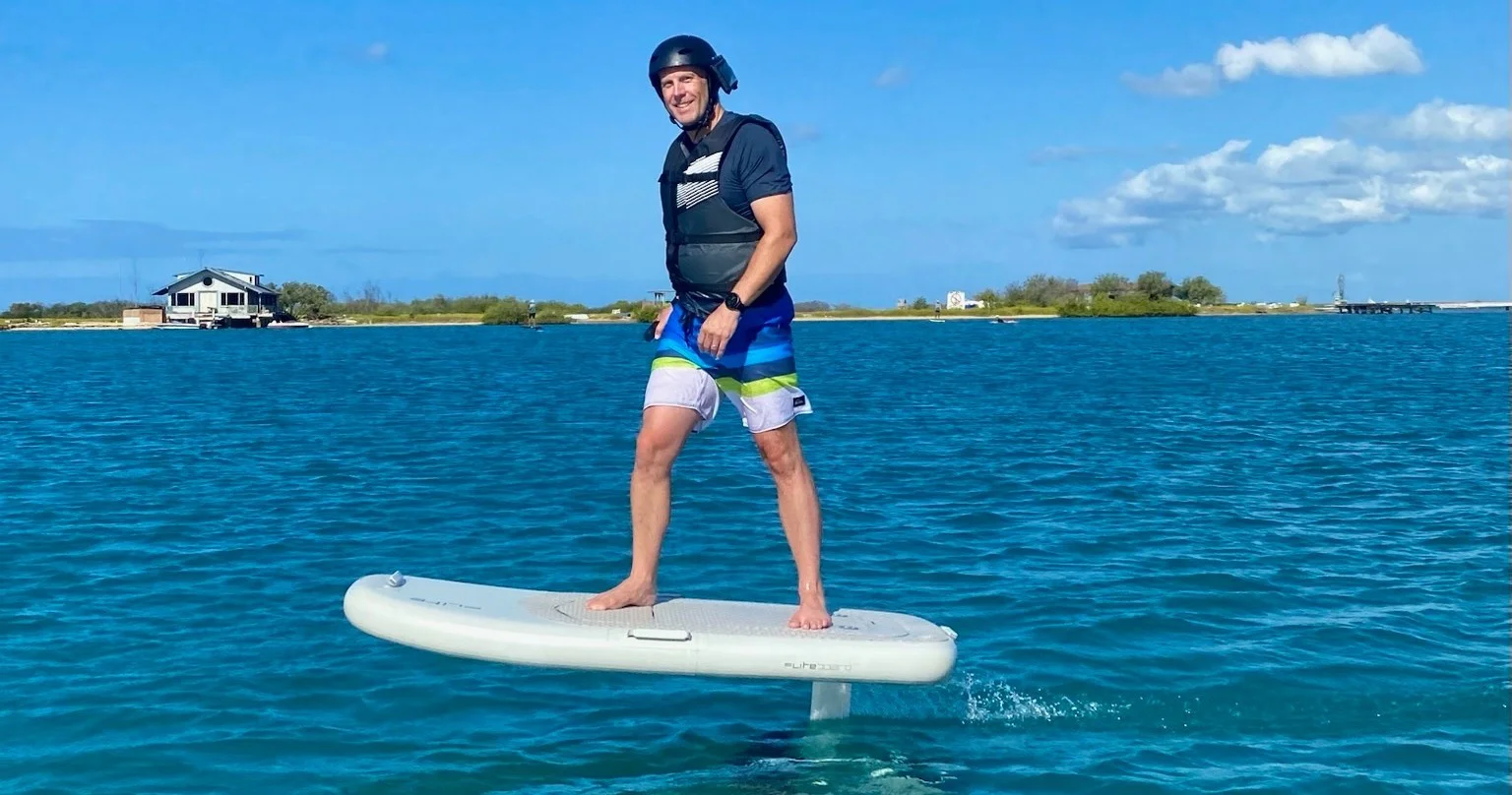 Full length eFoil hydrofoil session on the south shore of Oahu, Hawaii