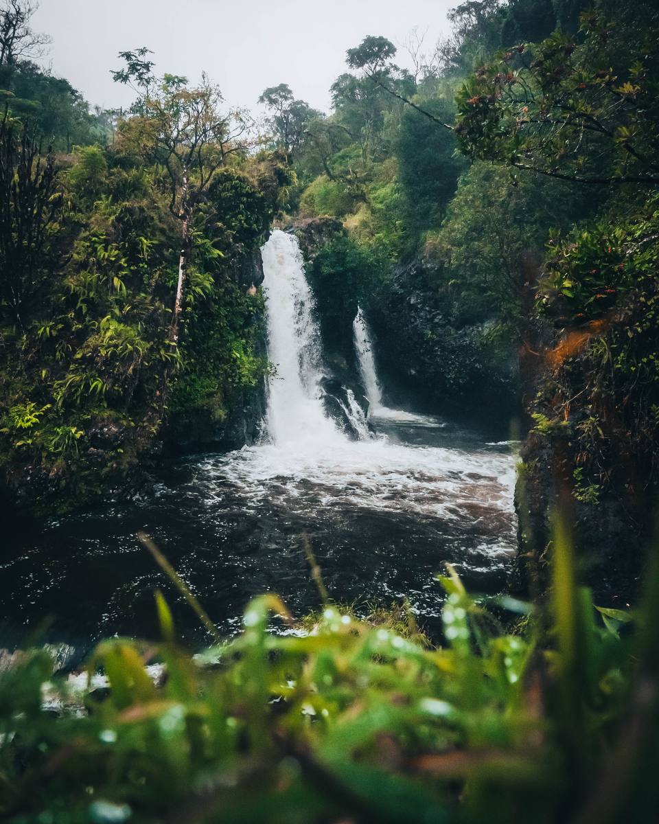Waterfall beside the Road to Hana on Maui, Hawaii, surrounded by tropical rainforest