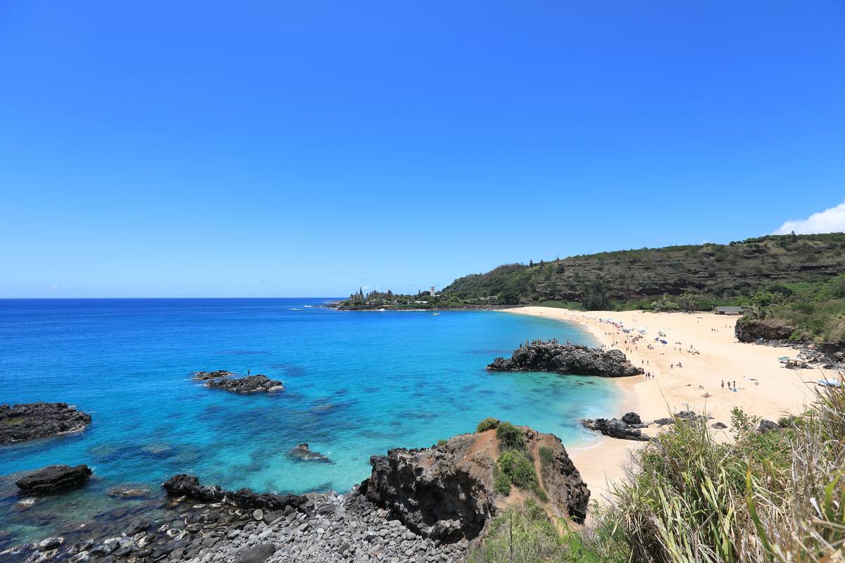 Waimea Bay Beach on the North Shore of Oahu, Hawaii, with turquoise water and headland