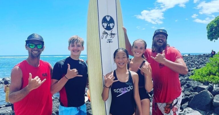 Small private surf group learning at Kahaluu Bay, Kailua-Kona
