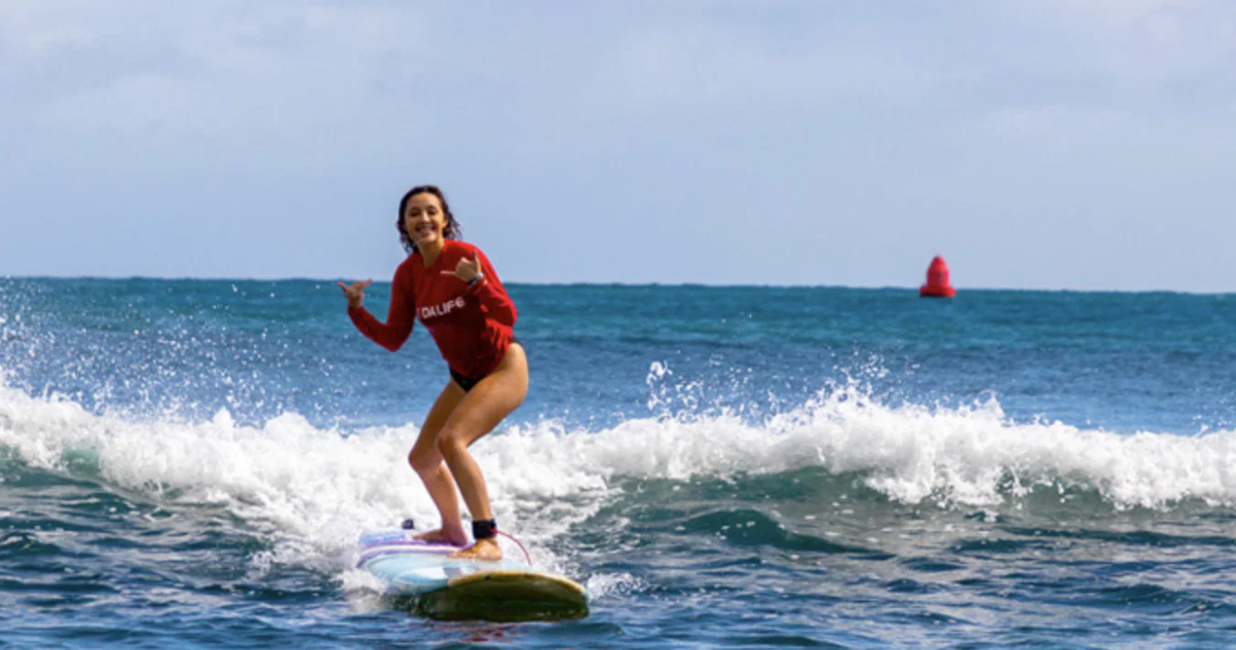 Beginner surf lesson in the gentle waves of Kalapaki Bay, Lihue, Kauai