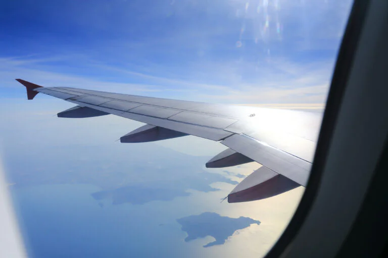 Looking out through an aircraft cabin window in flight